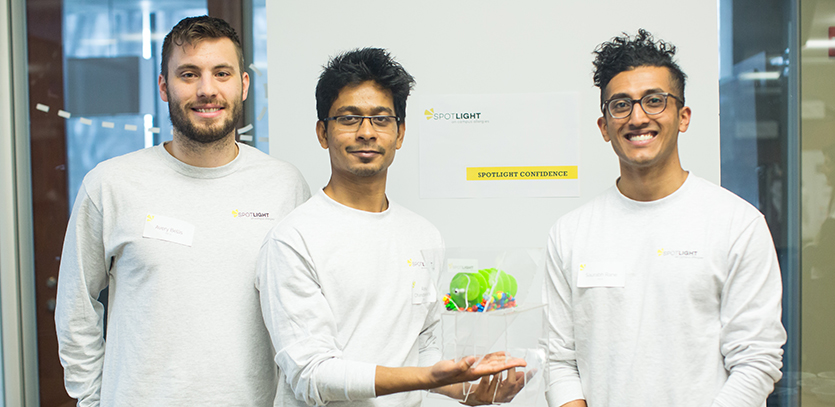 EDI students with their prototype for a zero contact dispensing method for salad bar ingredients.