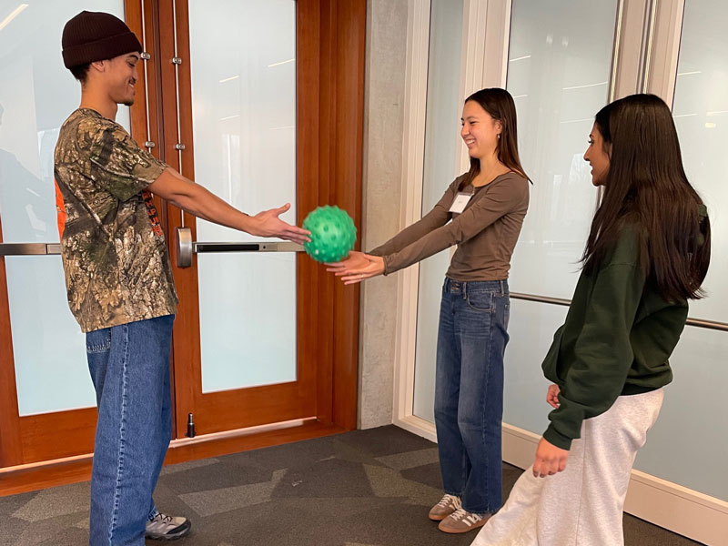 Students in the class learned about prompt engineering in a physical warm up exercise.